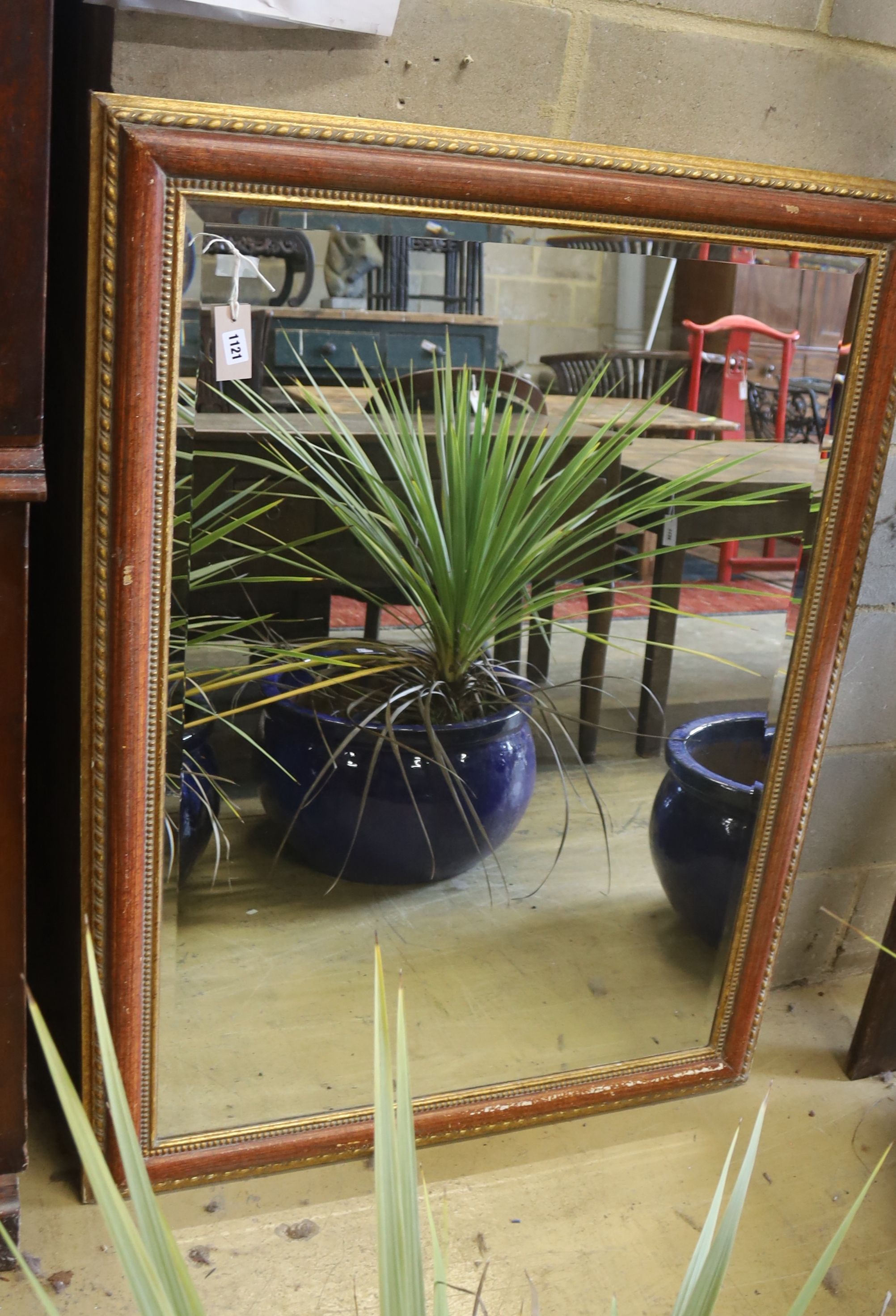 A rectangular parcel gilt wall mirror, width 94cm, height 124cm